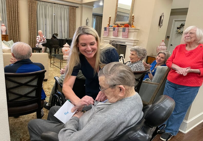 Nurse Helping Elderly Man in Skilled Nursing Facility Nurse Helping Elderly Man in Skilled Nursing Facility