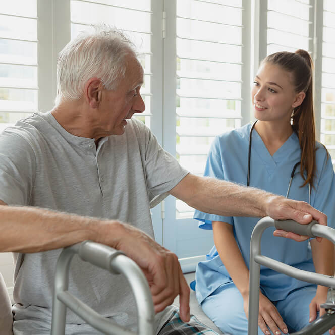 Caregiver Comforting Resident at Assisted Living Facility